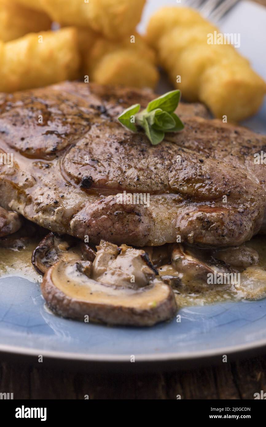 Pork steaks on mushroom sauce Stock Photo Alamy