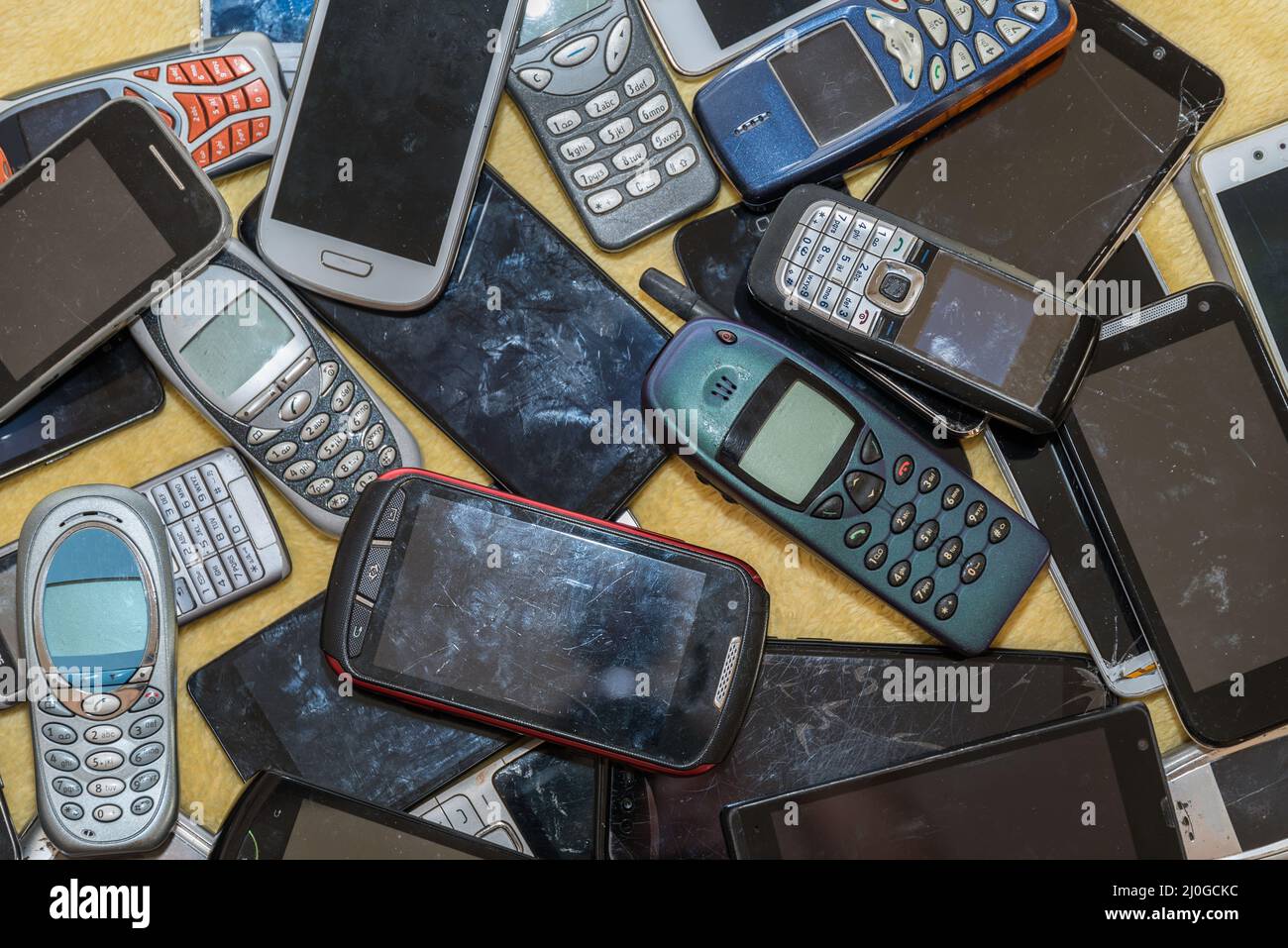 Old cell phones - valuable raw materials for recycling Stock Photo