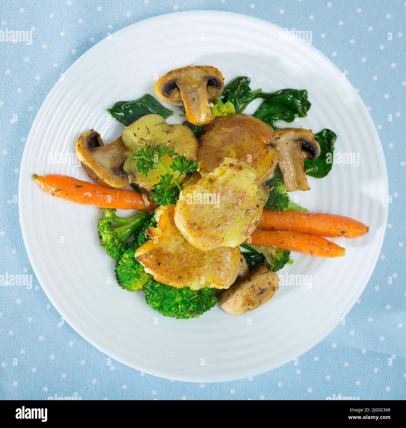 Crash Hot Potatoes with fried mushrooms Stock Photo Alamy