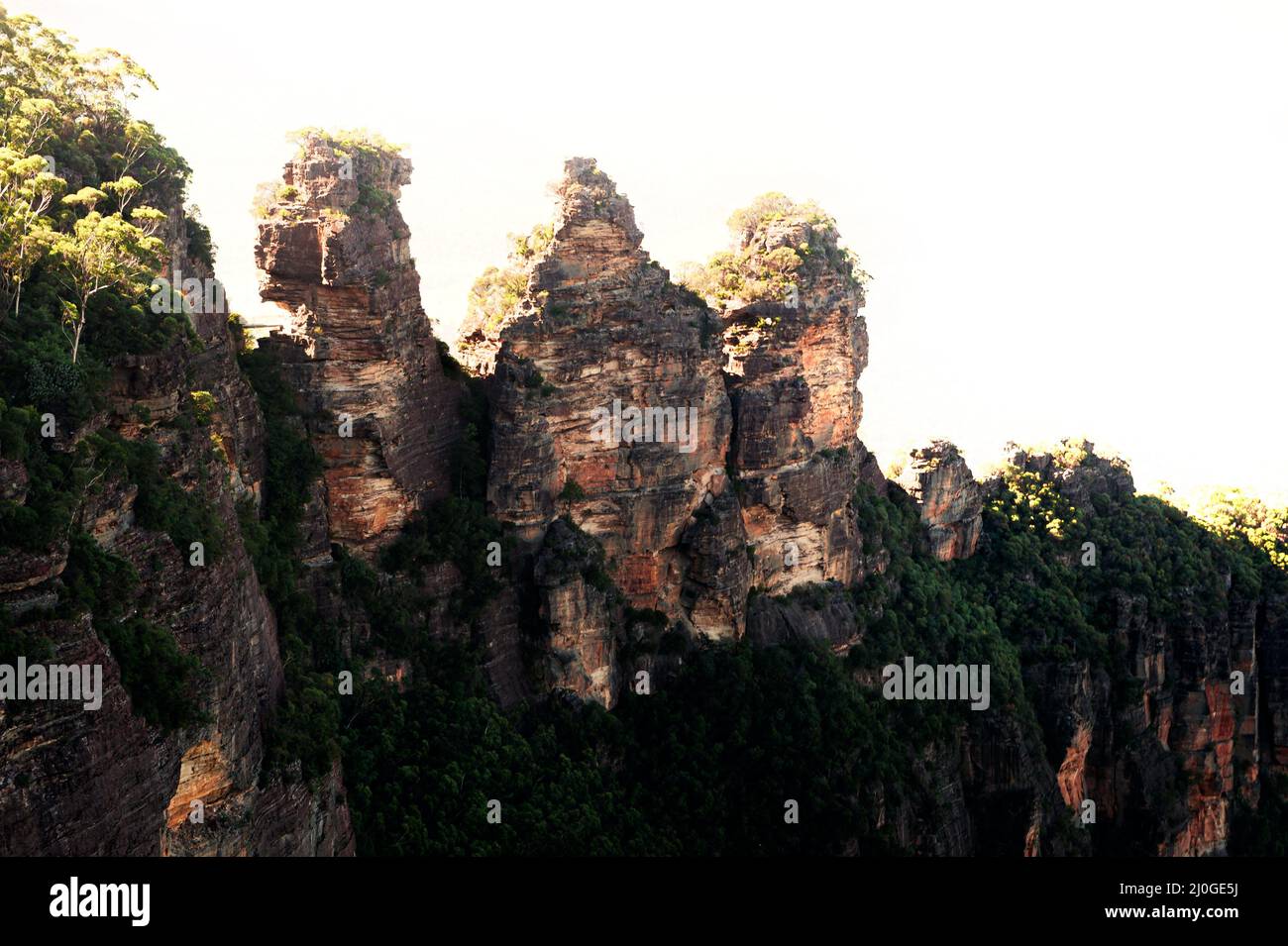 Famous rock formation of the Three Sisters above Jamison Valley in Blue Mountains National Park. Stock Photo