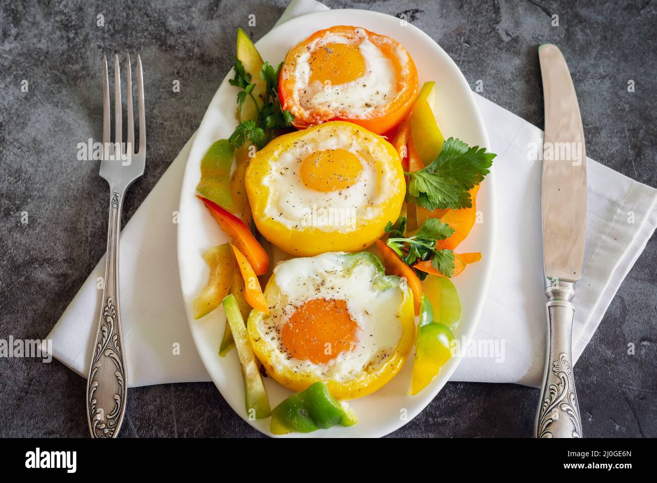 Baked bell pepper with egg inside the pepper Stock Photo Alamy