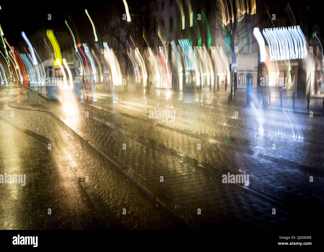 Cars motion on city rain night street Stock Photo - Alamy