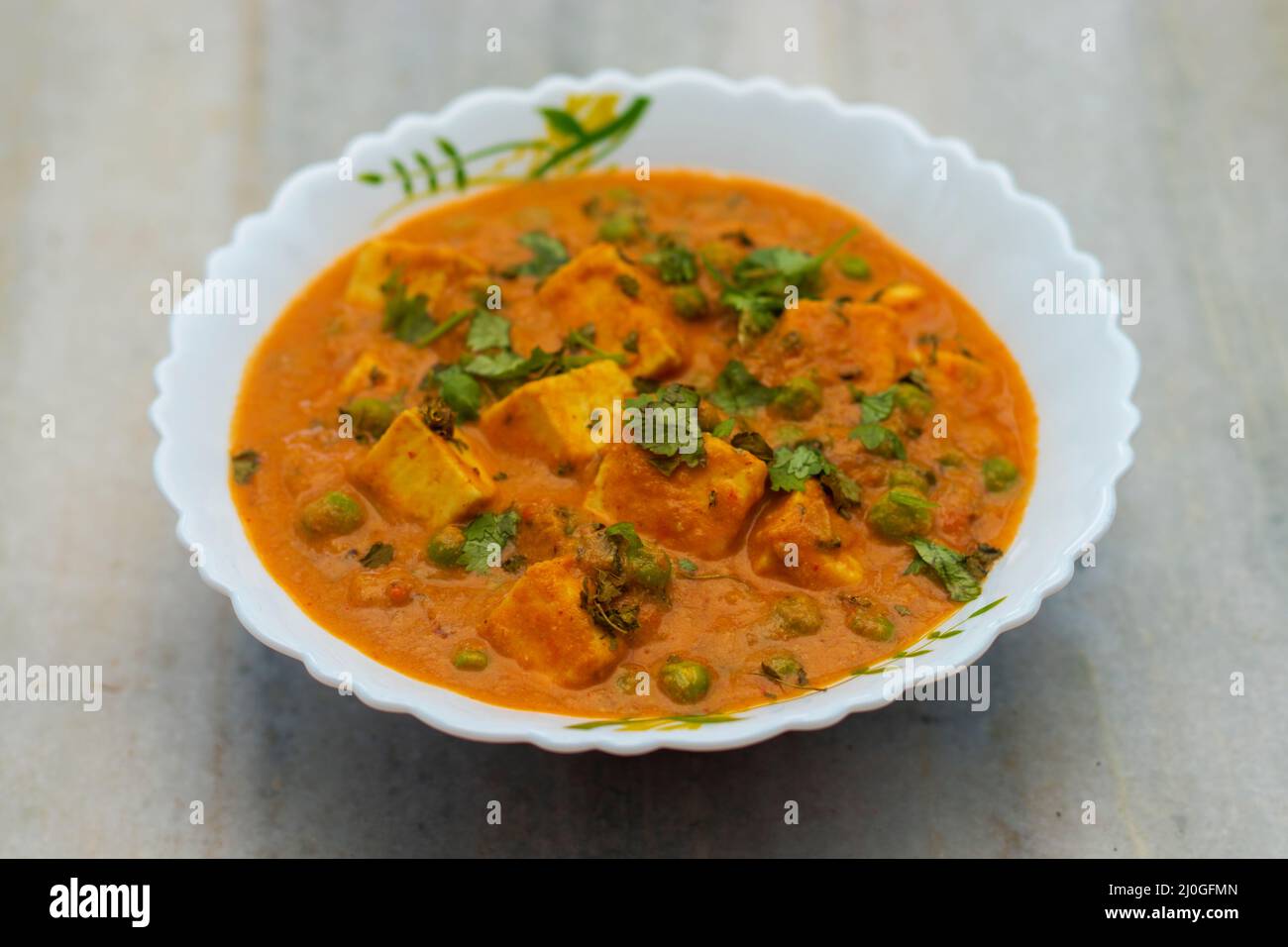 Famous Indian dish 'matar paneer' is ready to serve. Stock Photo