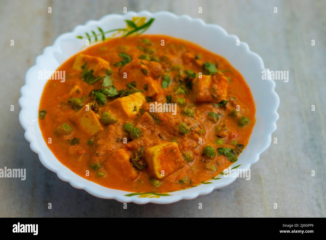 Famous Indian dish 'matar paneer' is ready to serve. Stock Photo