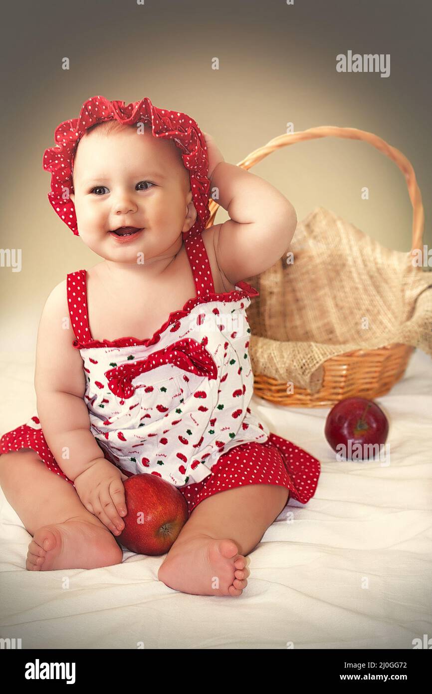 Little cute girl in red dress Stock Photo