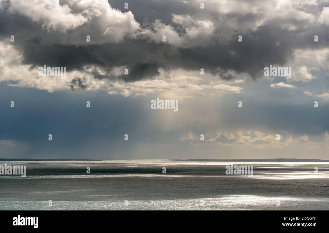 Stormy sky with dramatic clouds and sea. Stormy weather at the ocean Stock Photo