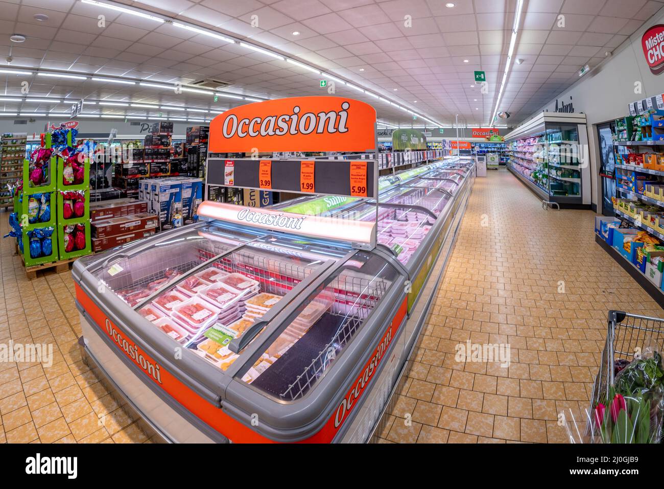 Fossano, Cuneo, Italy - March 18, 2022: interior of the LIDL supermarket with bargains in the meat refrigerated counters. Lidl Stiftung & Co KG is a G Stock Photo