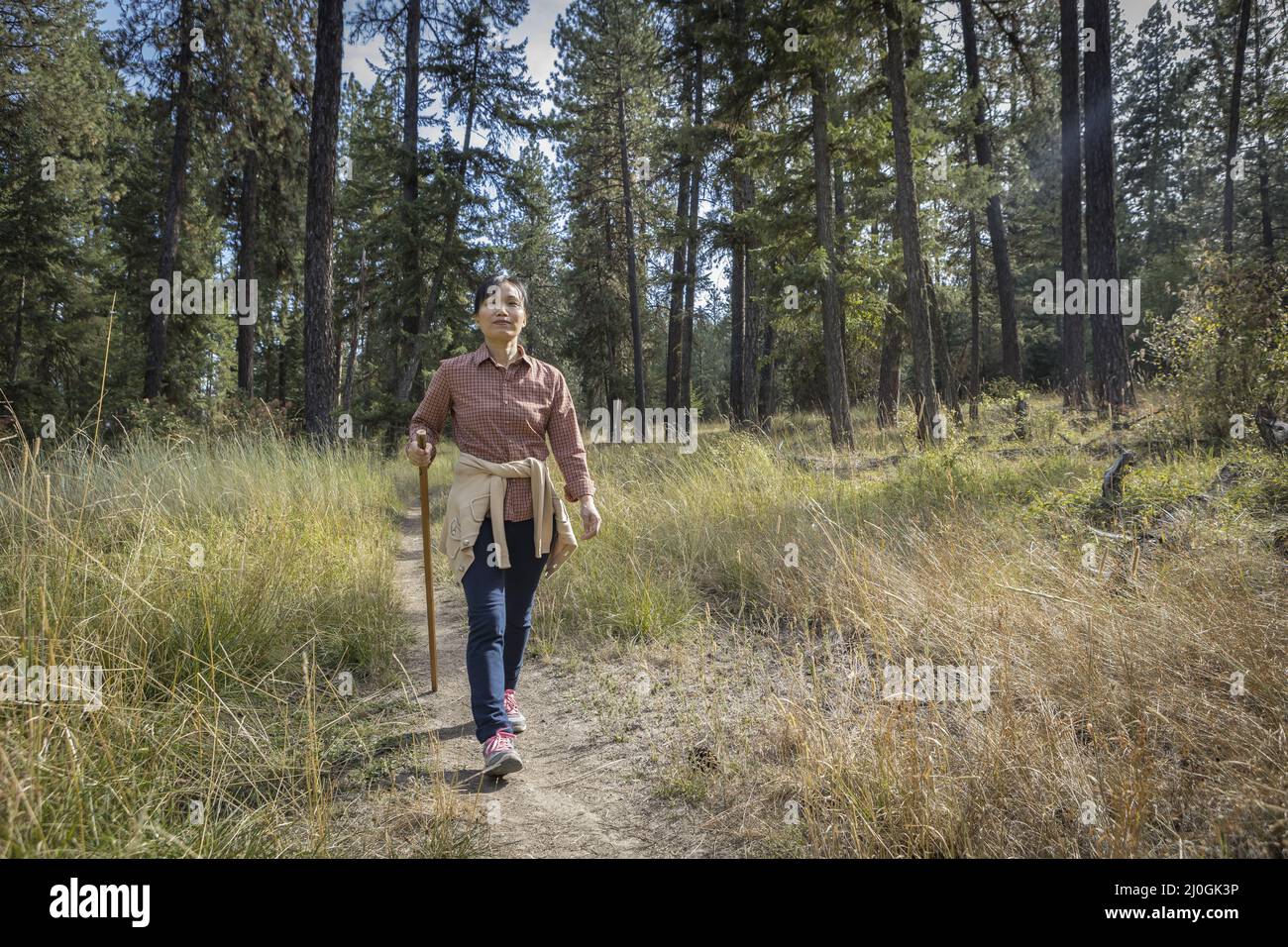 Happy woman walking stick hi-res stock photography and images - Alamy