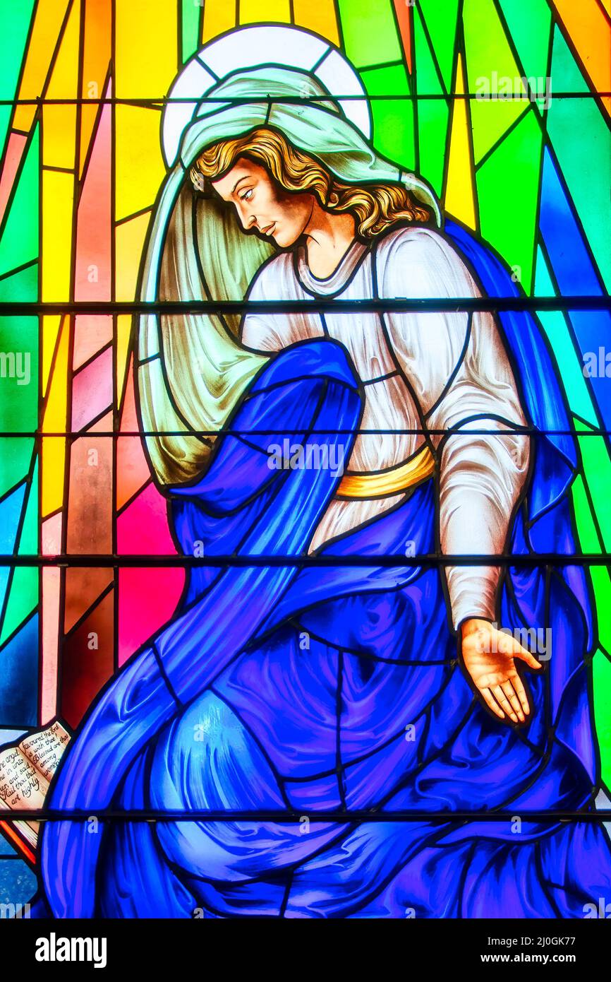 Virgin Mary kneeling stained-glass window seen in the Annunciation of the Blessed Virgin Mary Catholic Church, Toronto, Canada Stock Photo