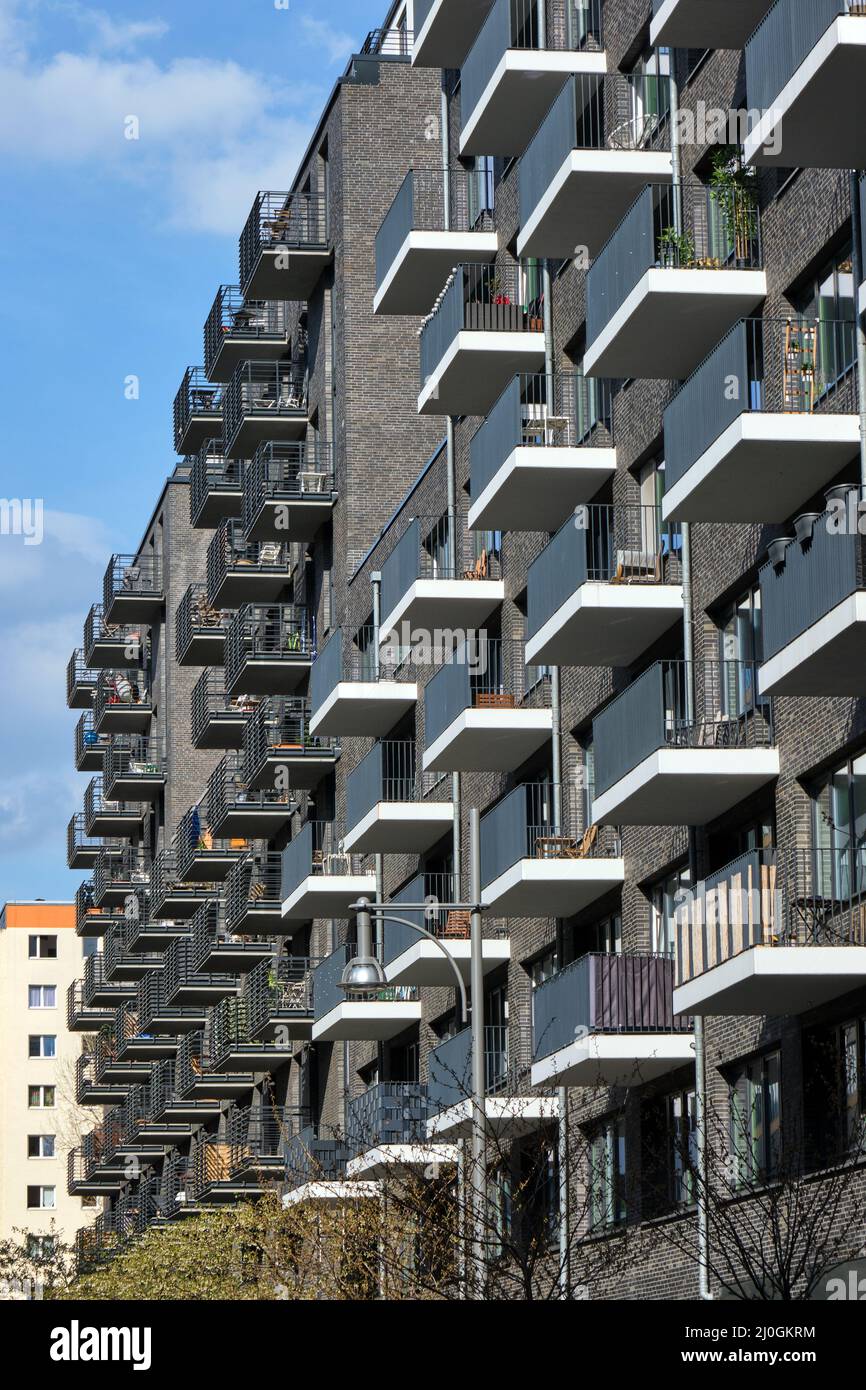 New gray apartment building made of bricks seen in Berlin, Germany Stock Photo
