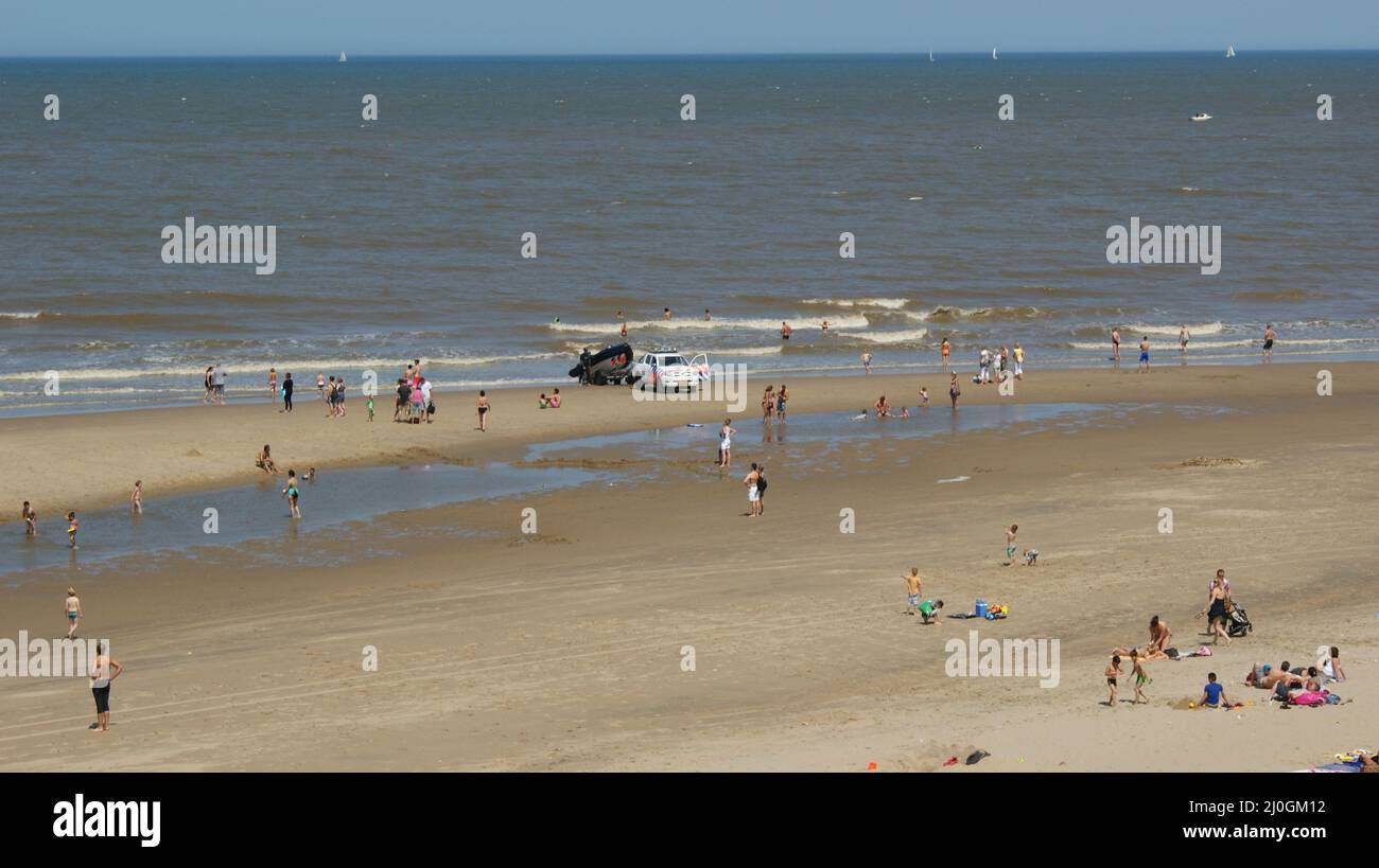 People sunbathing on the Scheveningen beach in the Netherlands Stock