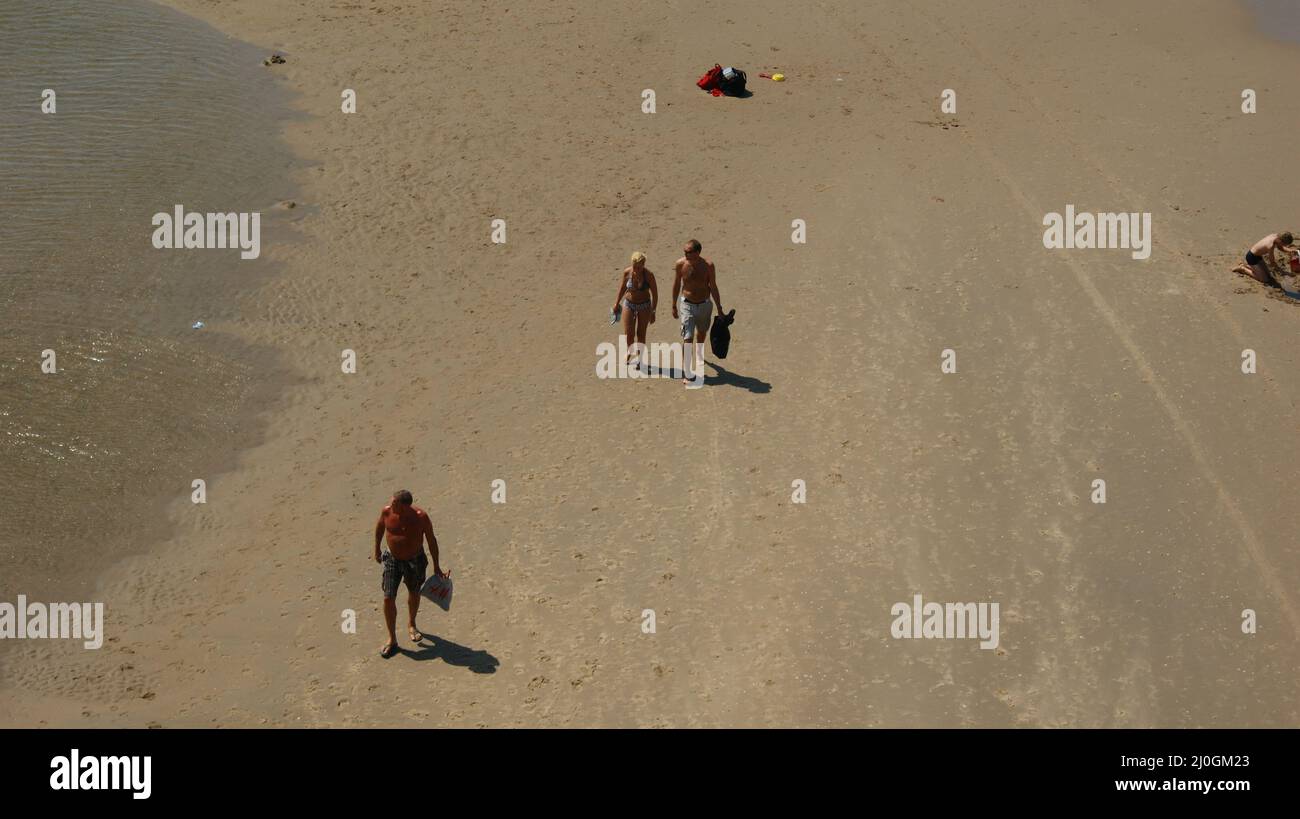 People sunbathing on the Scheveningen beach in the Netherlands Stock