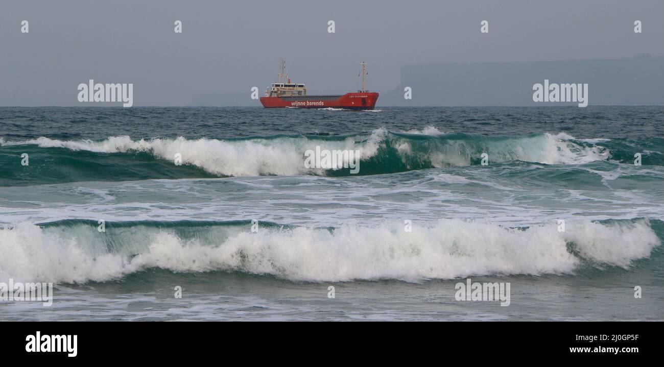 Lady Alexandra cargo ship manoeuvring to anchor off the beach Sardinero Santander Cantabria Spain Stock Photo