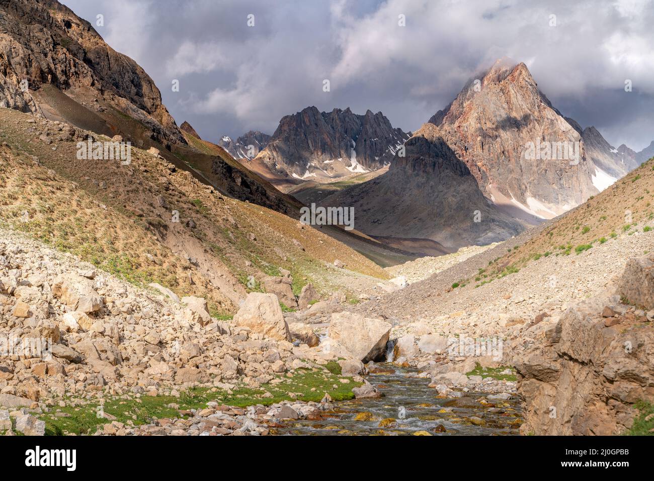 The beautiful view of blue sky and snow mountain summit near to Zmeya peak in Fann mountains in Tajikistan Stock Photo
