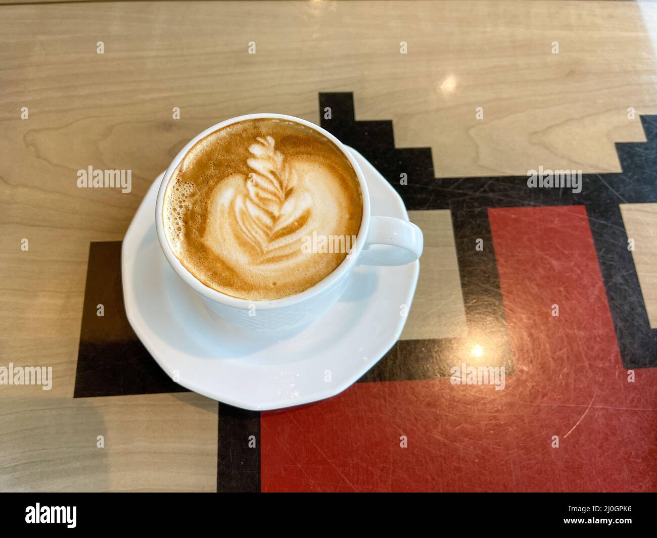 A delicious cup of cappuccino served on a cruise ship. Stock Photo