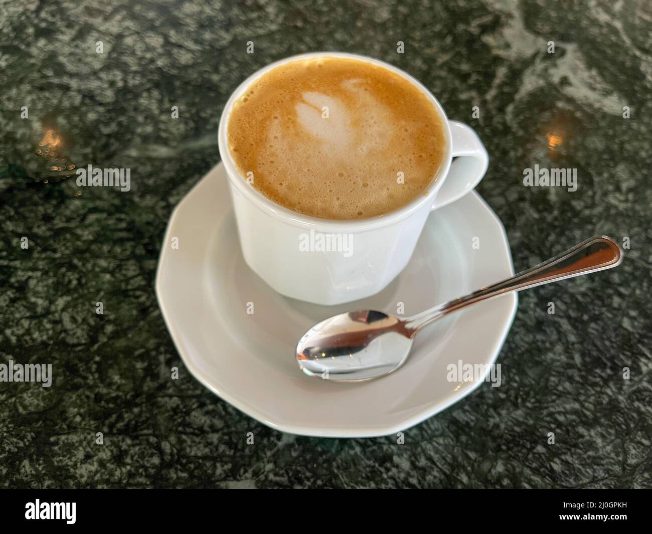 A delicious cup of cappuccino served on a cruise ship. Stock Photo