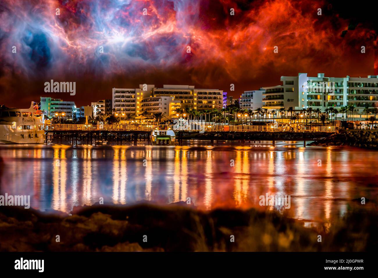 Beautiful night view of a city under the mystical sky Stock Photo - Alamy