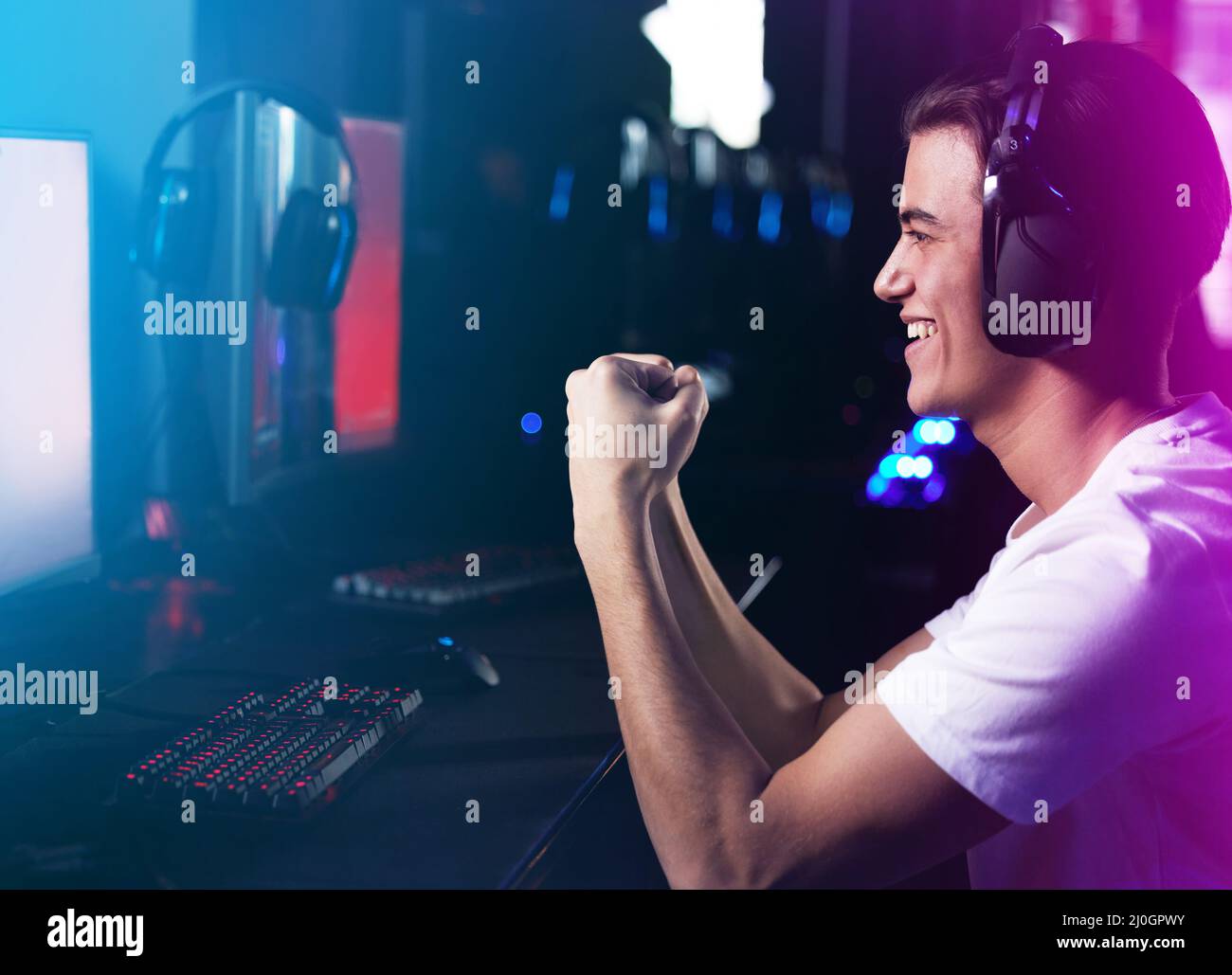 Young adult man cheering win hi-res stock photography and images - Alamy