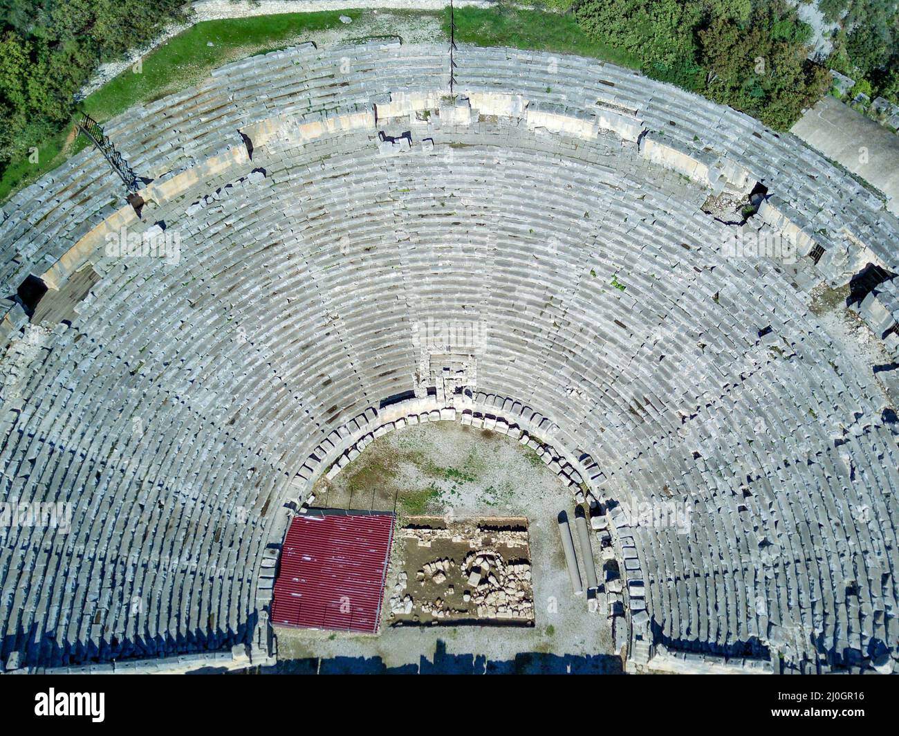 High angle drone aerial view of ancient greek rock cut lykian empire amphitheatre and tombs in Myra (Demre Stock Photo