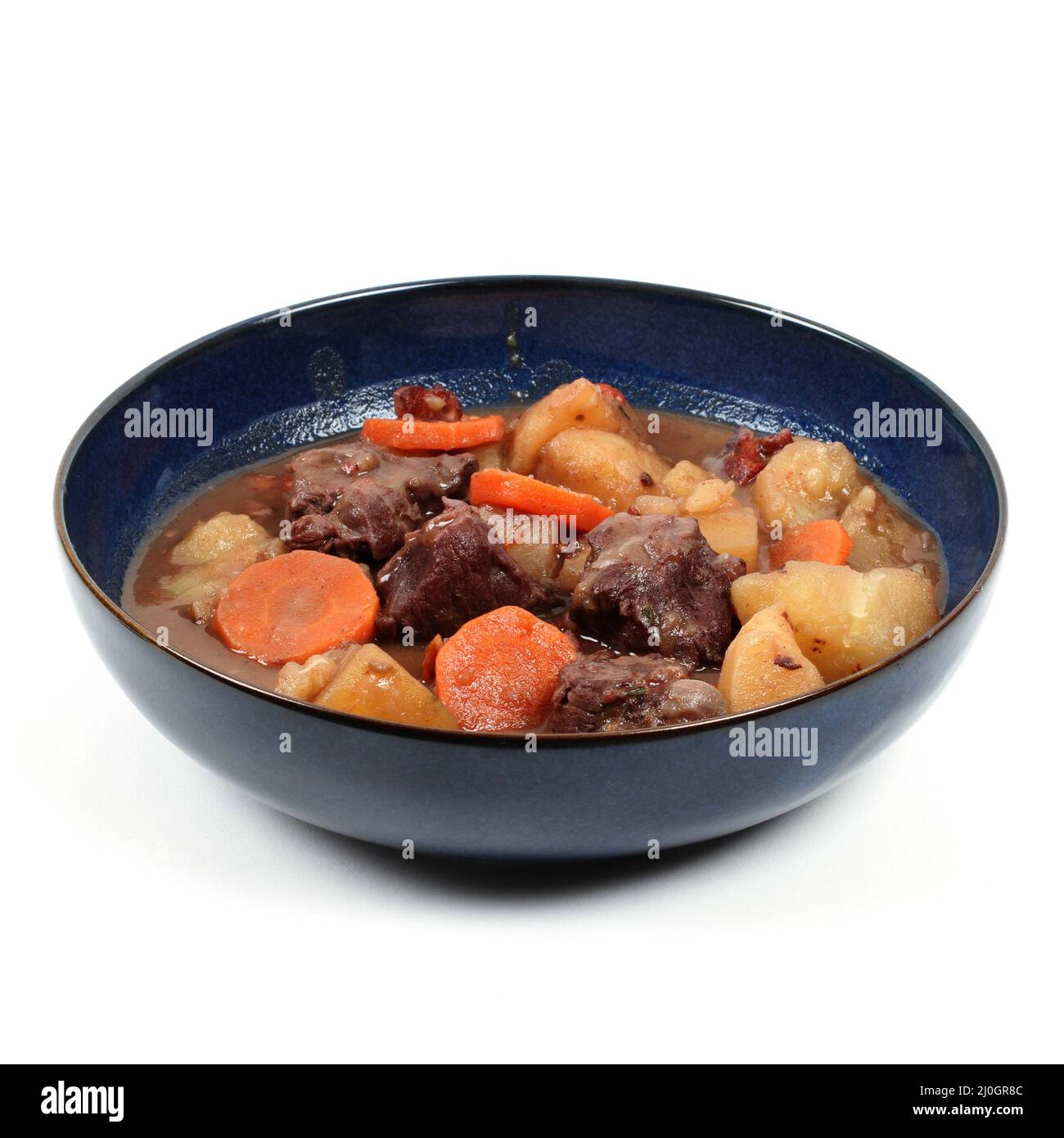 Bourguignon beef in a deep plate on a white background Stock Photo