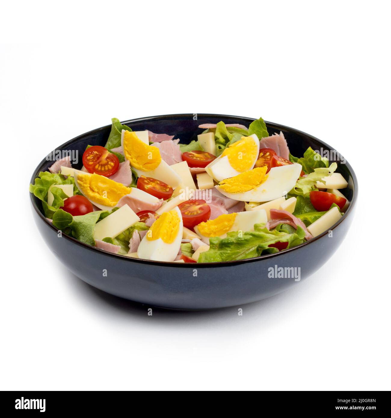 Parisian Salad - salad, ham, cheese, tomatoes, egg - studio photography Stock Photo