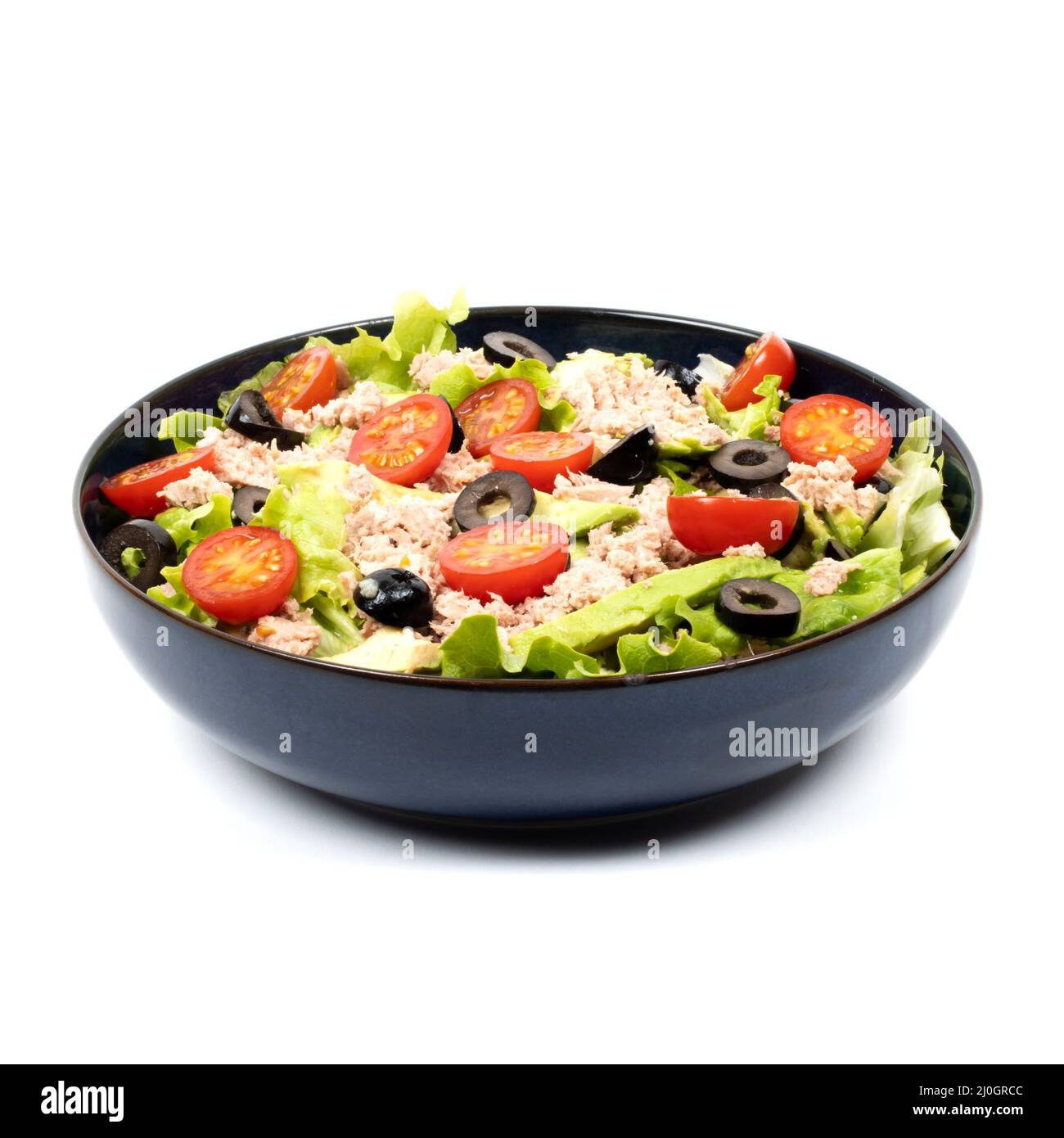 salad, avocado, tuna, tomatoes, olive in a bowl on a white background - studio shot Stock Photo