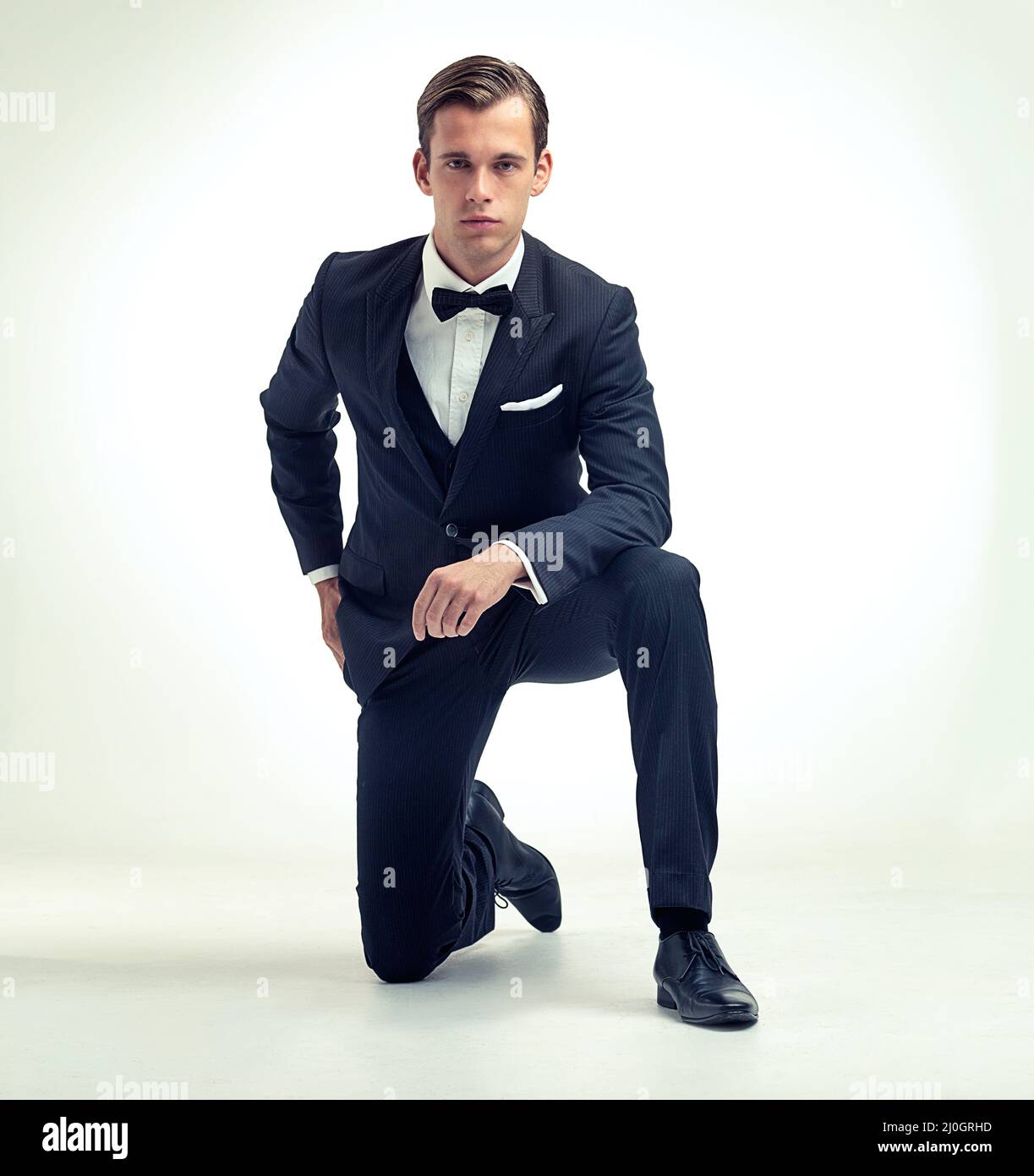 Man kneeling suit hi-res stock photography and images - Alamy