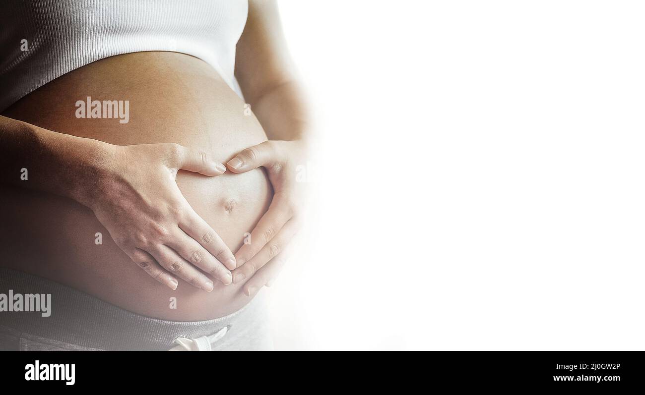Pregnant woman's belly Stock Photo