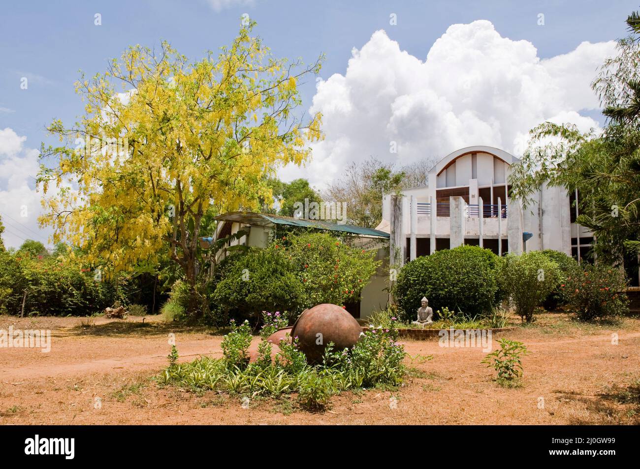 Auroville, India - May 2016: House with garden in Auromodele community Stock Photo