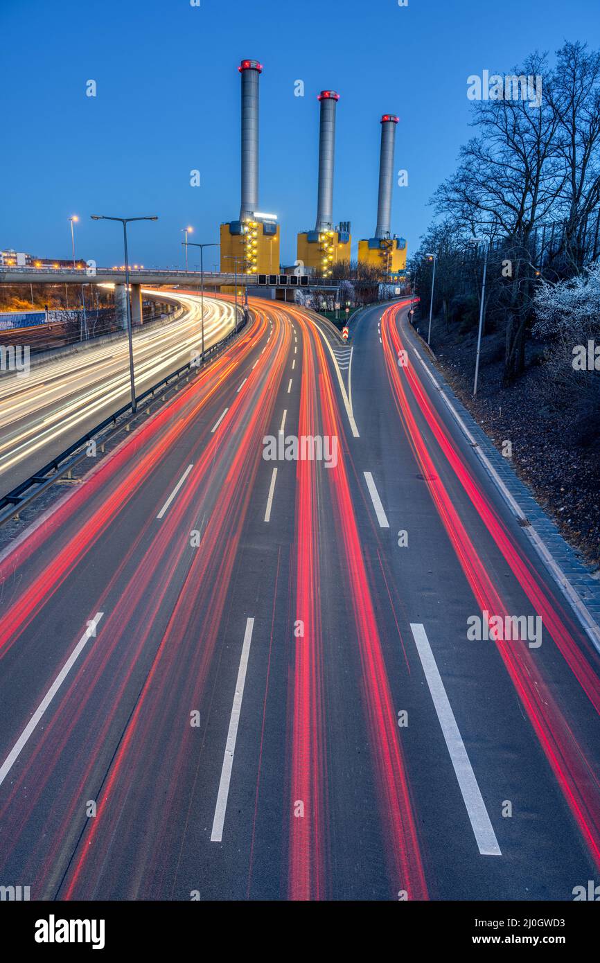 Freeway and power station at dusk seen in Berlin, Germany Stock Photo