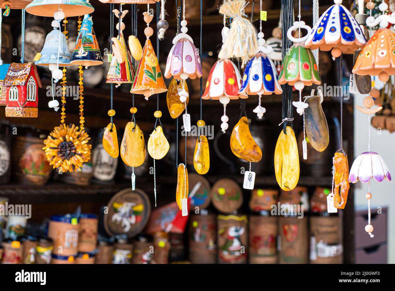 Necklaces, other amber souvenirs and terracotta little bells. Amber of  different colors and sizes. Exposition of stones of amber for tourists  souvenir Stock Photo - Alamy