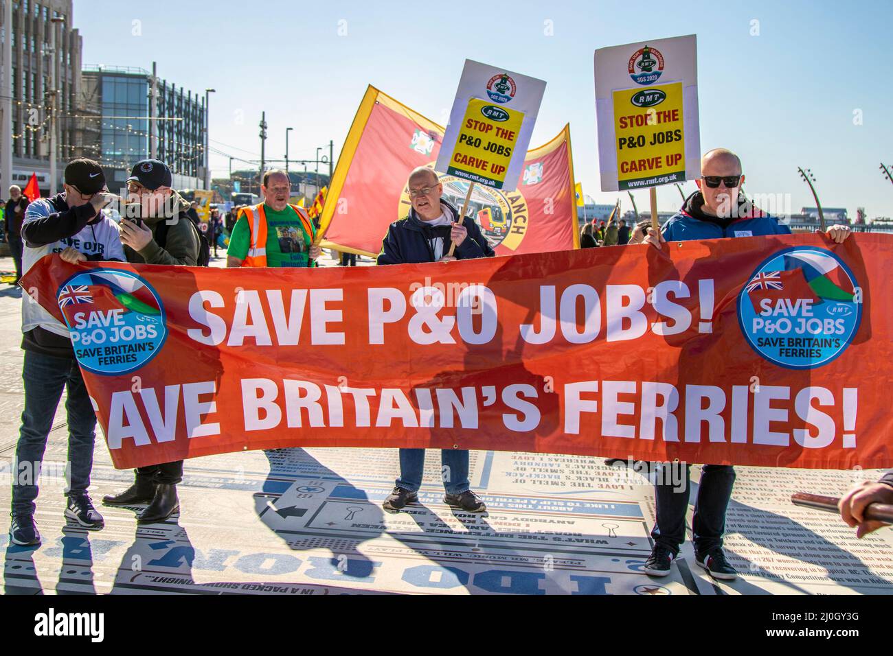 Save P&O jobs, Save Britain's Ferries Anti-Tory Protestors & campaigners gather on the seafront promenade with flags, trade union banners, placards, publications & hand written signs to protest against the Tory Government. Blackpool, Lancashire.UK 19 March 2022; Boris Johnson will return to Blackpool Winter Gardens, for the Conservative Party's Spring Conference. The delegates' arrival for two days of speeches and debate will be the most high-profile event at the new complex since the renovations were completed. requirements.  Credit MediaWorldImages/AlamyLiveNews Stock Photo