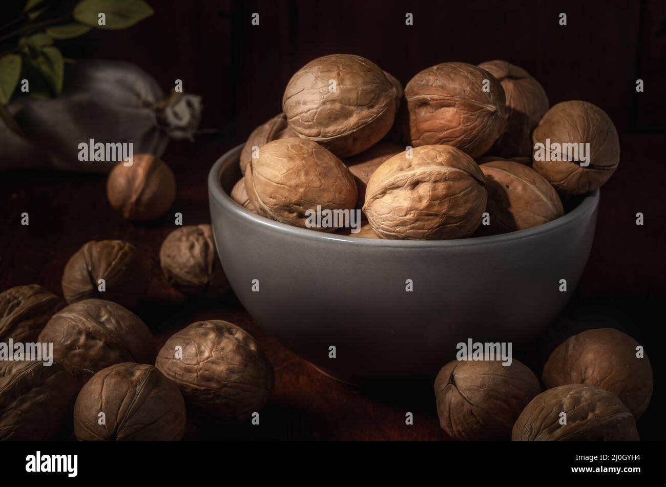 Walnuts on a dark background in a rustic style Stock Photo