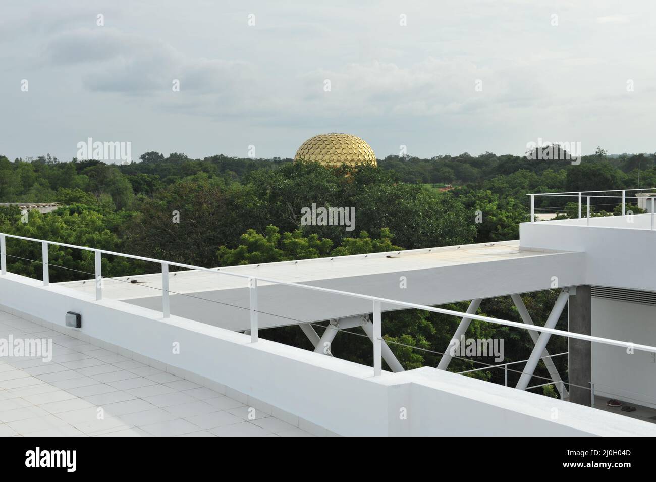 Auroville, India - November 2017: The Matrimandir seen by the terrace of the Sunship complex, built in 2017 Stock Photo