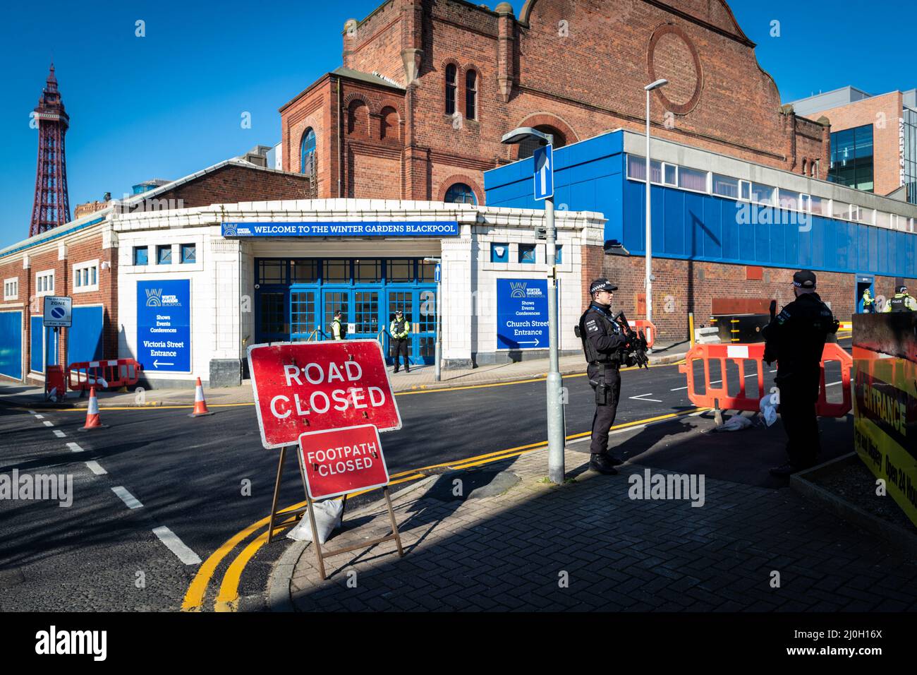 Blackpool, UK. 19th Mar, 2022. Police stand guard outside the Winter Gardens where this years Spring Tory Party Conference is being held. Locals and Unions join in unity to make sure the MP's hear that they are not wanted in one of the most deprived towns in the country. This comes after the cost of living crisis is set to make this year one of the most difficult in decades. Credit: Andy Barton/Alamy Live News Stock Photo