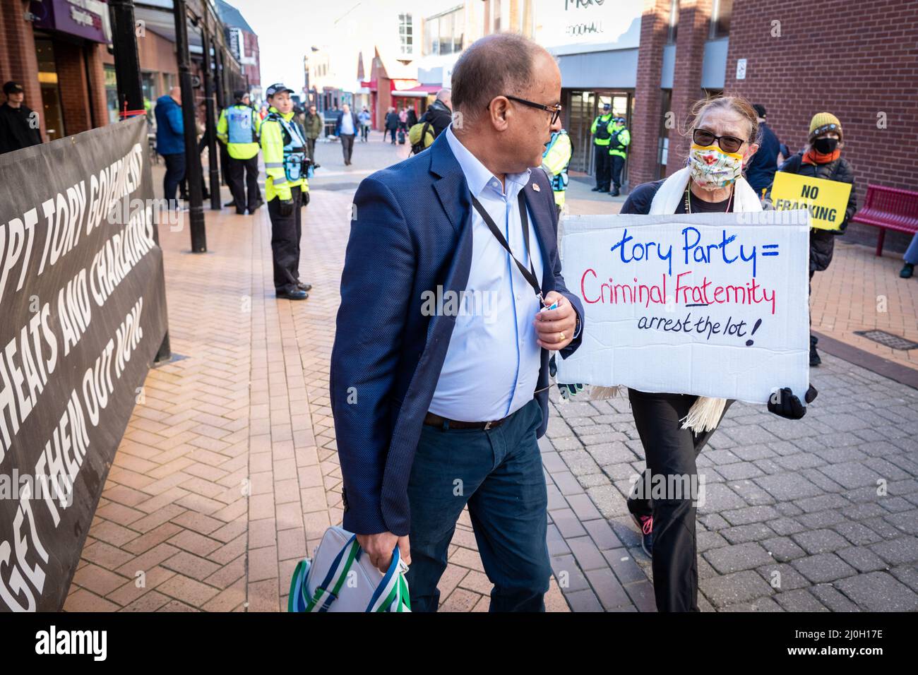 Blackpool, UK. 19th Mar, 2022. Protesters with placards confront delegates as they arrive at the Spring Conservative Party Conference. Locals and Unions join in unity to make sure the MP's hear that they are not wanted in one of the most deprived towns in the country. This comes after the cost of living crisis is set to make this year one of the most difficult in decades. Credit: Andy Barton/Alamy Live News Stock Photo