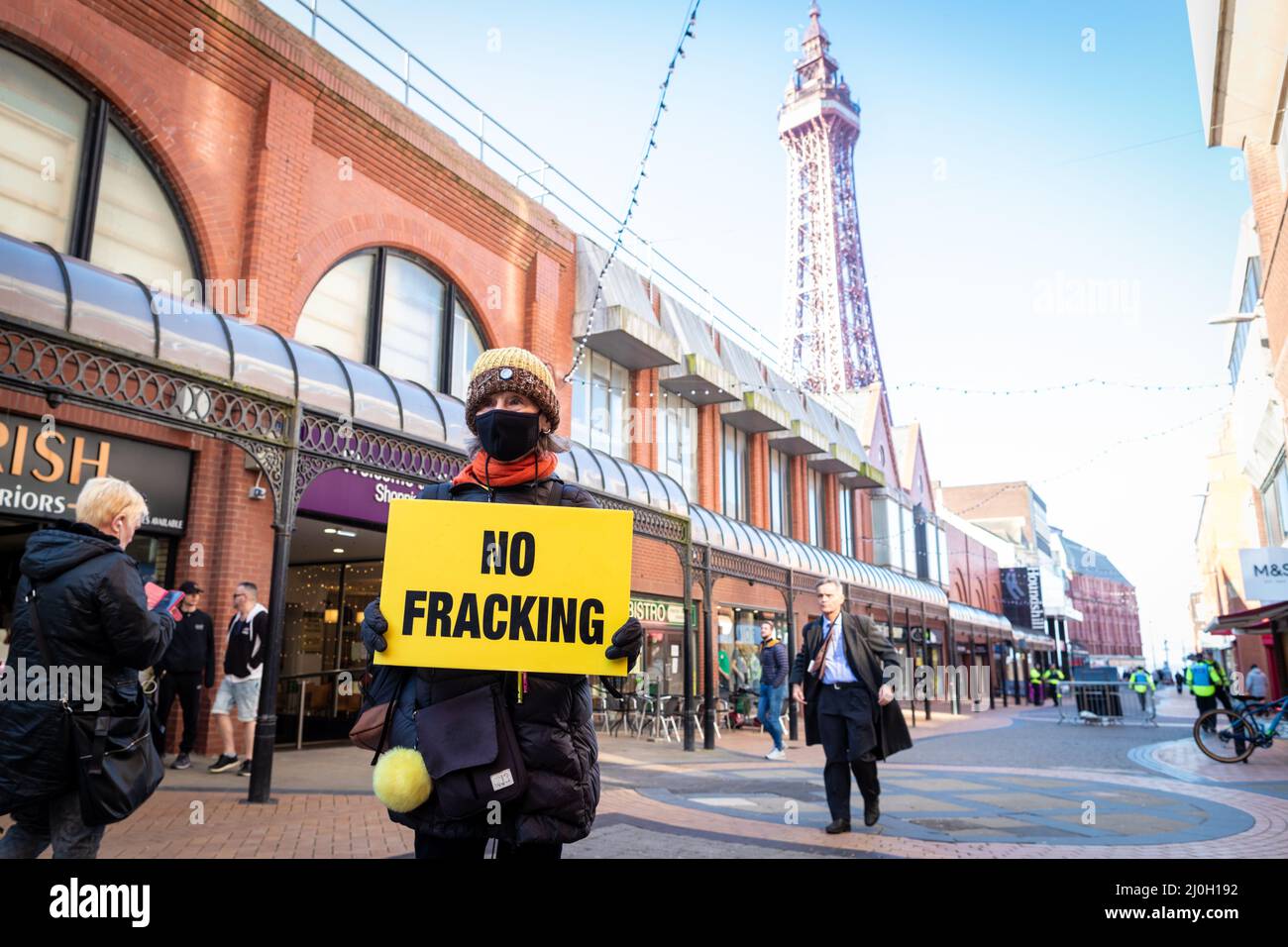 Blackpool, UK. 19th Mar, 2022. A protester with a fracking placard awaits the start of the march against the Spring Tory Party Conference. Locals and Unions join in unity to make sure the MP's hear that they are not wanted in one of the most deprived towns in the country. This comes after the cost of living crisis is set to make this year one of the most difficult in decades. Credit: Andy Barton/Alamy Live News Stock Photo