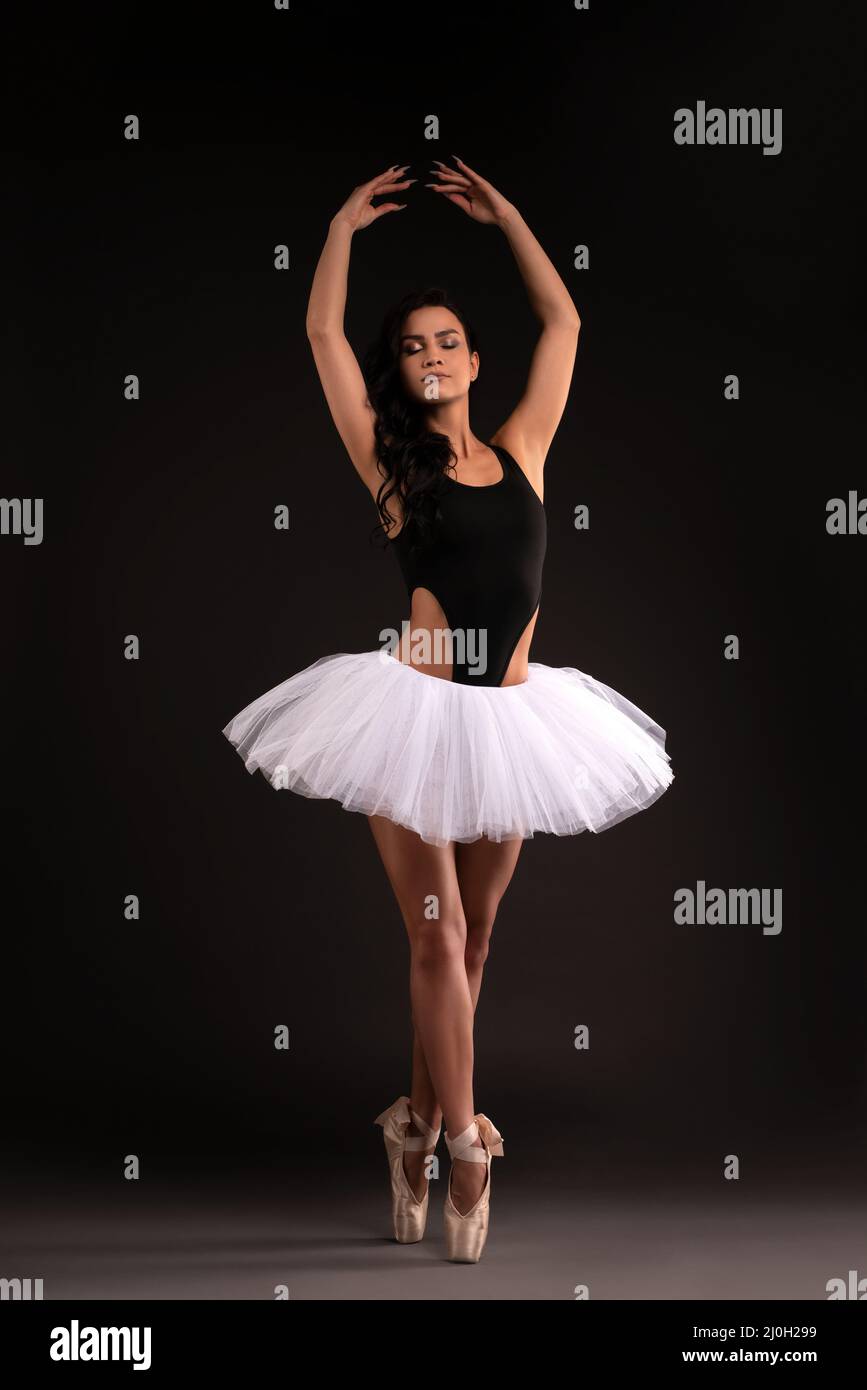 Pretty ballerina in tutu stand on pointess Stock Photo