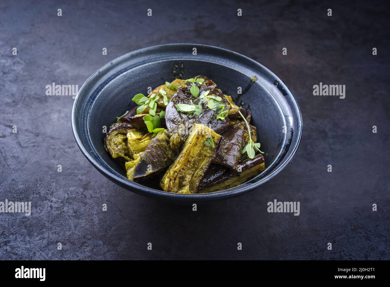 Traditional Indian eggplant curry fry served as side dish in a design