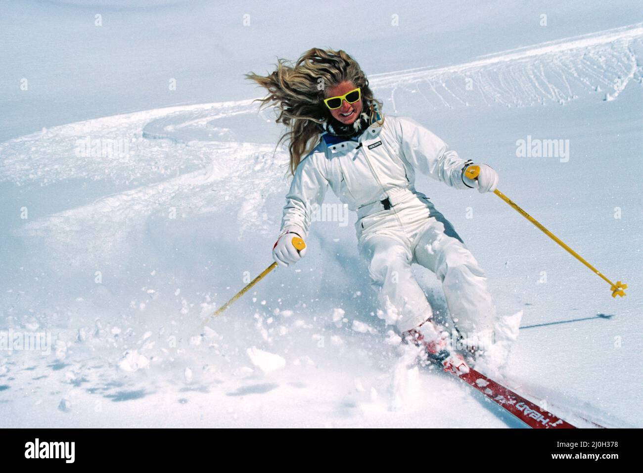 New Zealand. Snow skiing. Young woman downhill skiing. Stock Photo