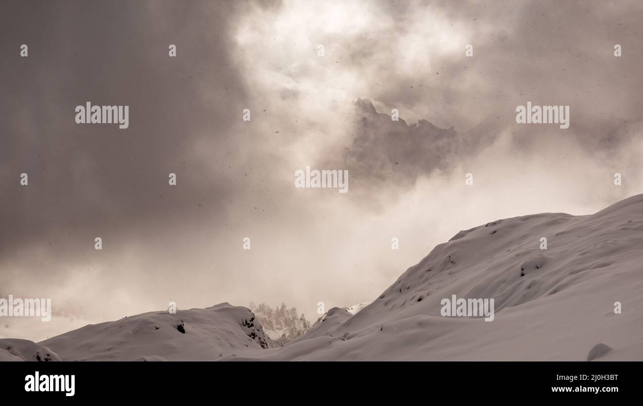 Clouds carrying snow in the italian alps Stock Photo - Alamy