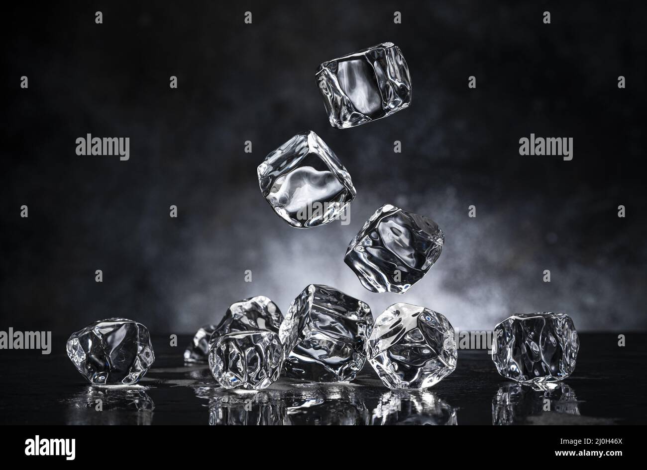 Ice cubes on black background Stock Photo - Alamy