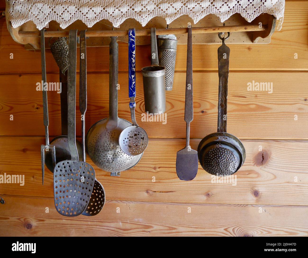 https://c8.alamy.com/comp/2J0H47D/historical-kitchen-utensils-hanging-in-kitchen-of-old-farmhouse-high-quality-photo-2J0H47D.jpg