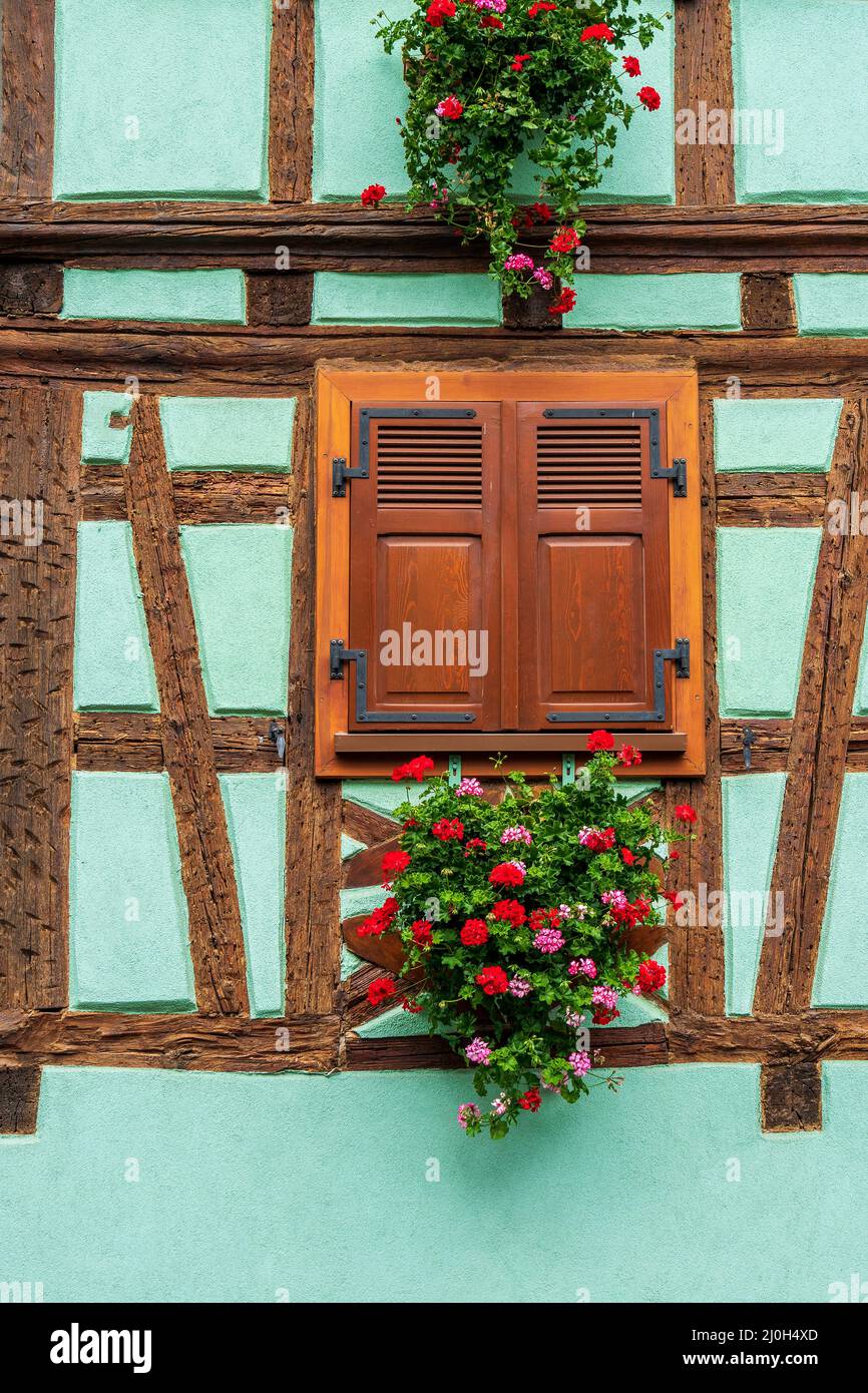 Window decorating with flowers on old timber frame house Stock Photo ...