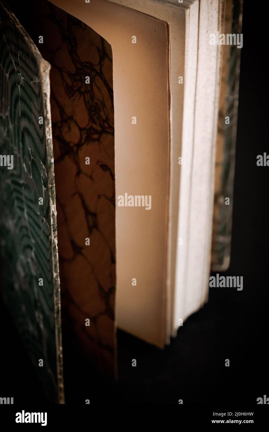 Old book on black background Stock Photo