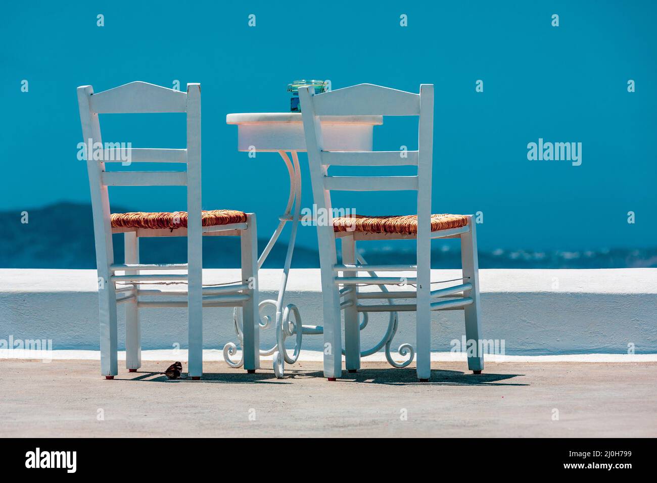 Two chairs and a table on white terrace Stock Photo Alamy
