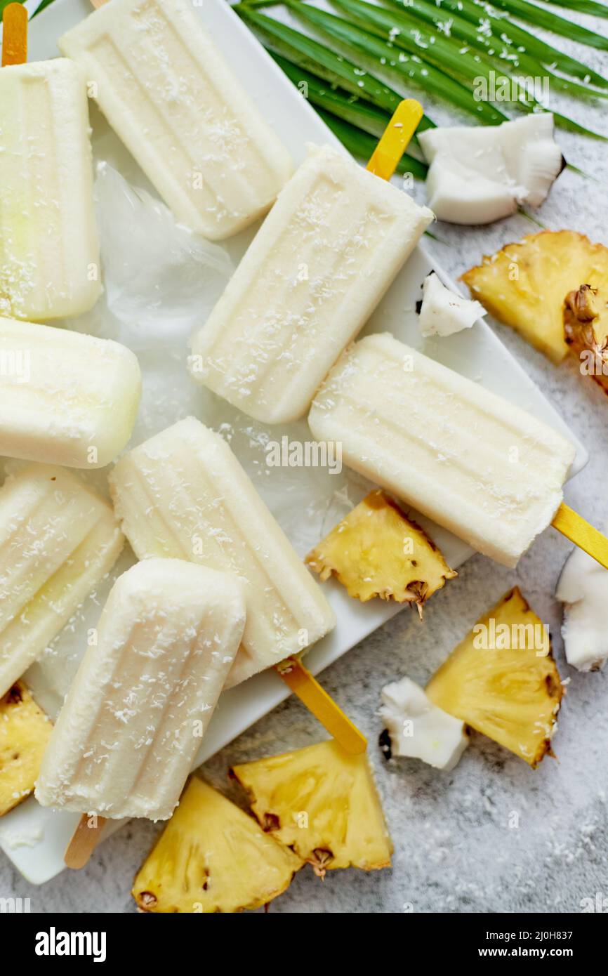 Homemade vegan popsicles made with coconut milk and pineapple