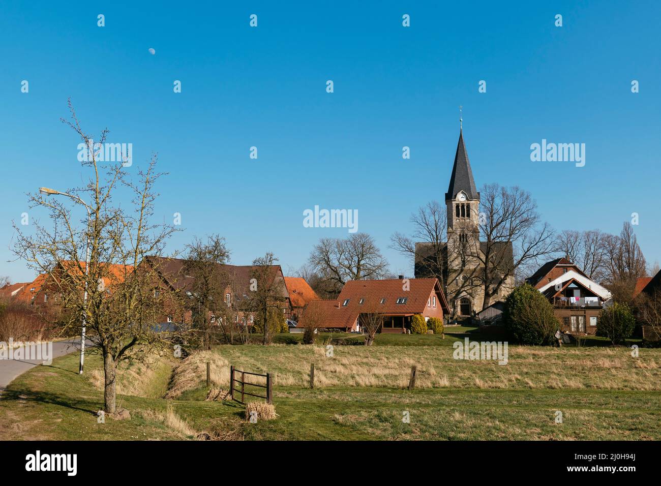 View of the Frille, a vilage close to Petershagen in East-Westphalia with Protestant church. Stock Photo