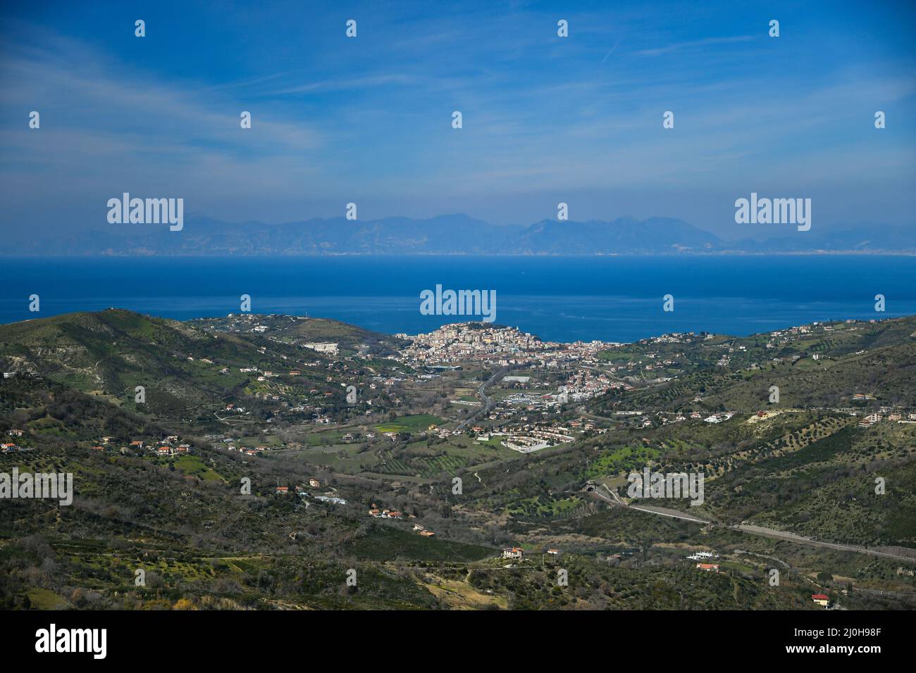 Mesmerizing view of the buildings on the green hills in the village of