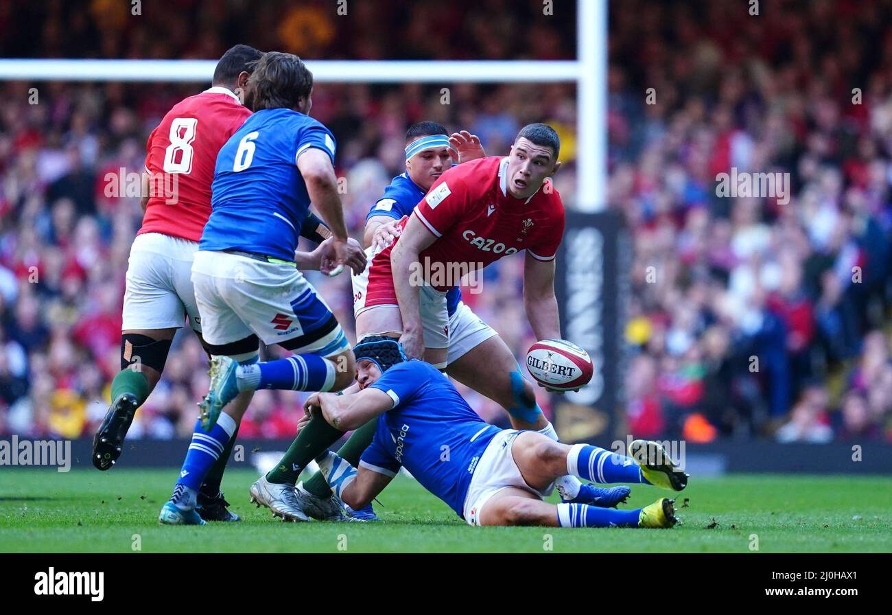 Wales' Seb Davies is tackled by Italy's Ignacio Brex Juan during the Guinness Six Nations match at the Principality Stadium, Cardiff. Picture date: Saturday March 19, 2022. Stock Photo